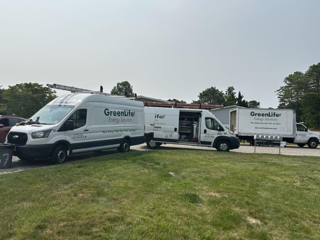 GreenLife Energy Solutions Trucks Parked At Work Site (House)