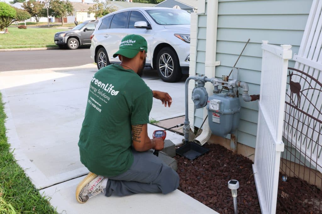 GreenLife auditor checking for gas leaks.