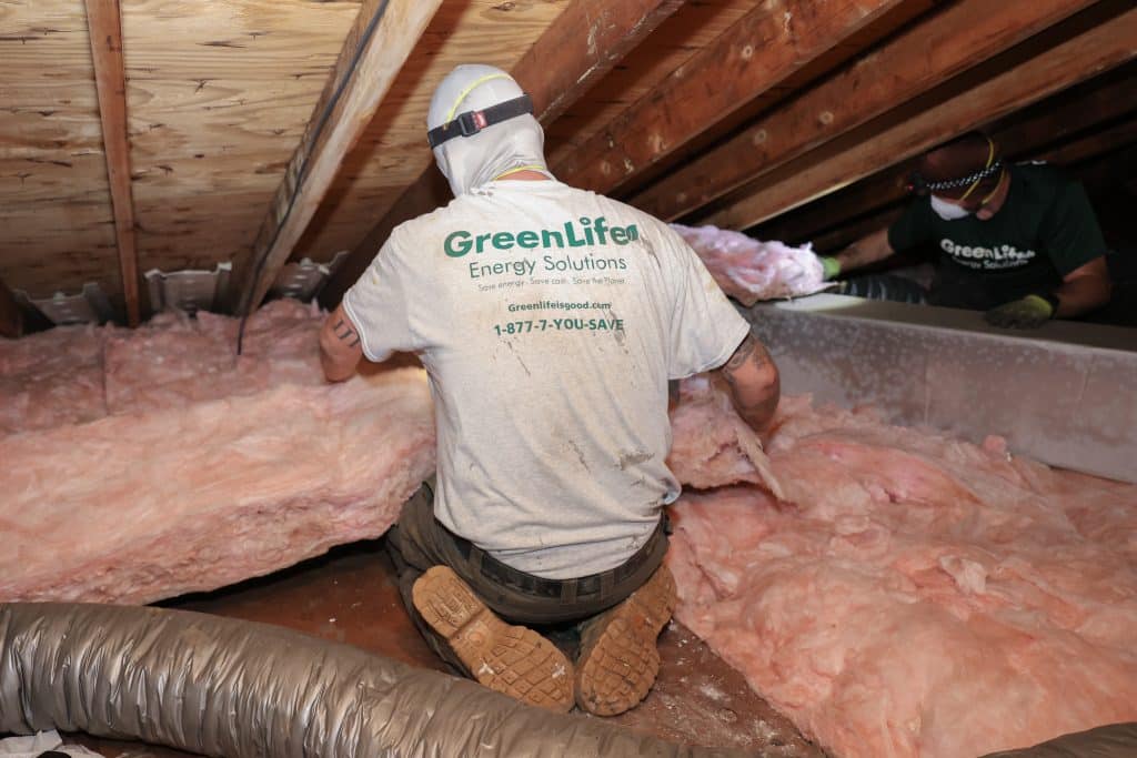GreenLife employee installing an Attic Insulation