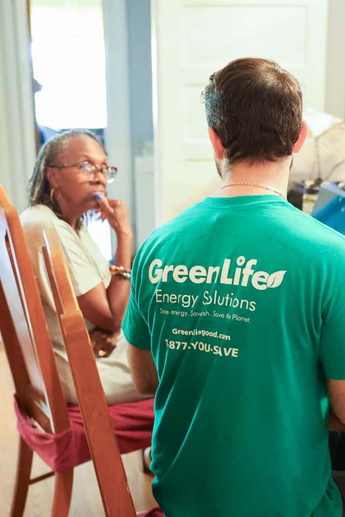 GreenLife auditor talking to a customer