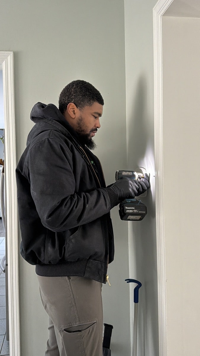 HVAC technician performing maintenance