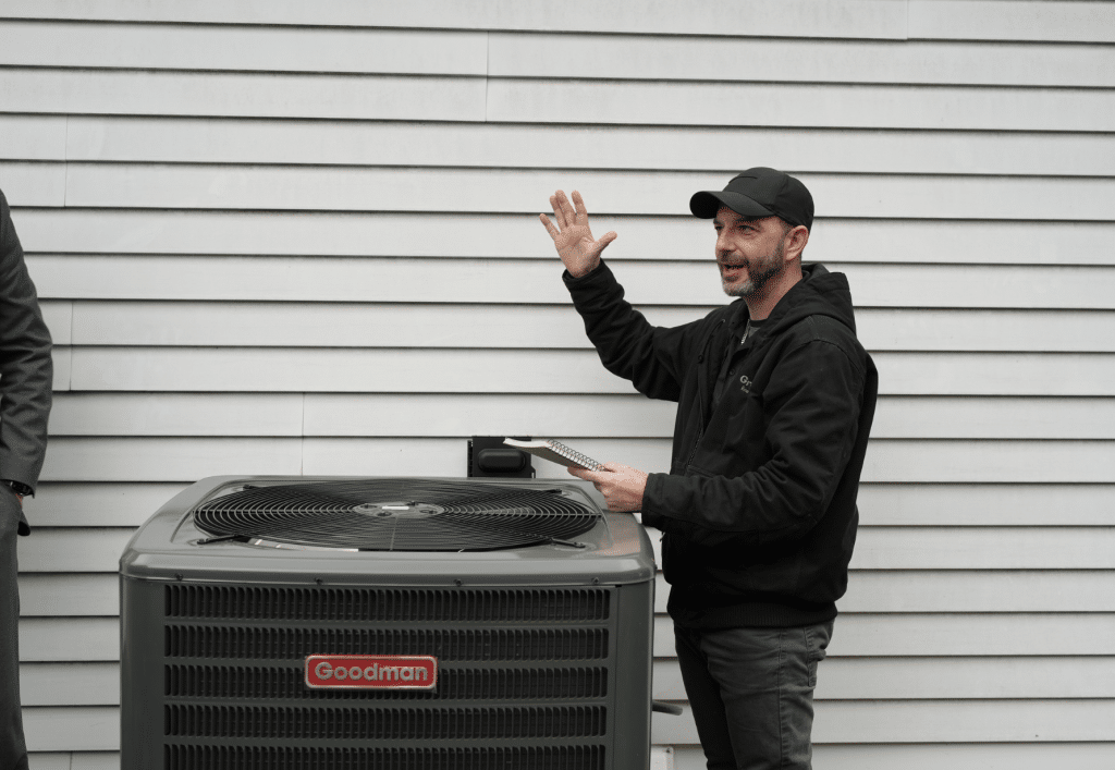 GreenLife employee with an AC Unit