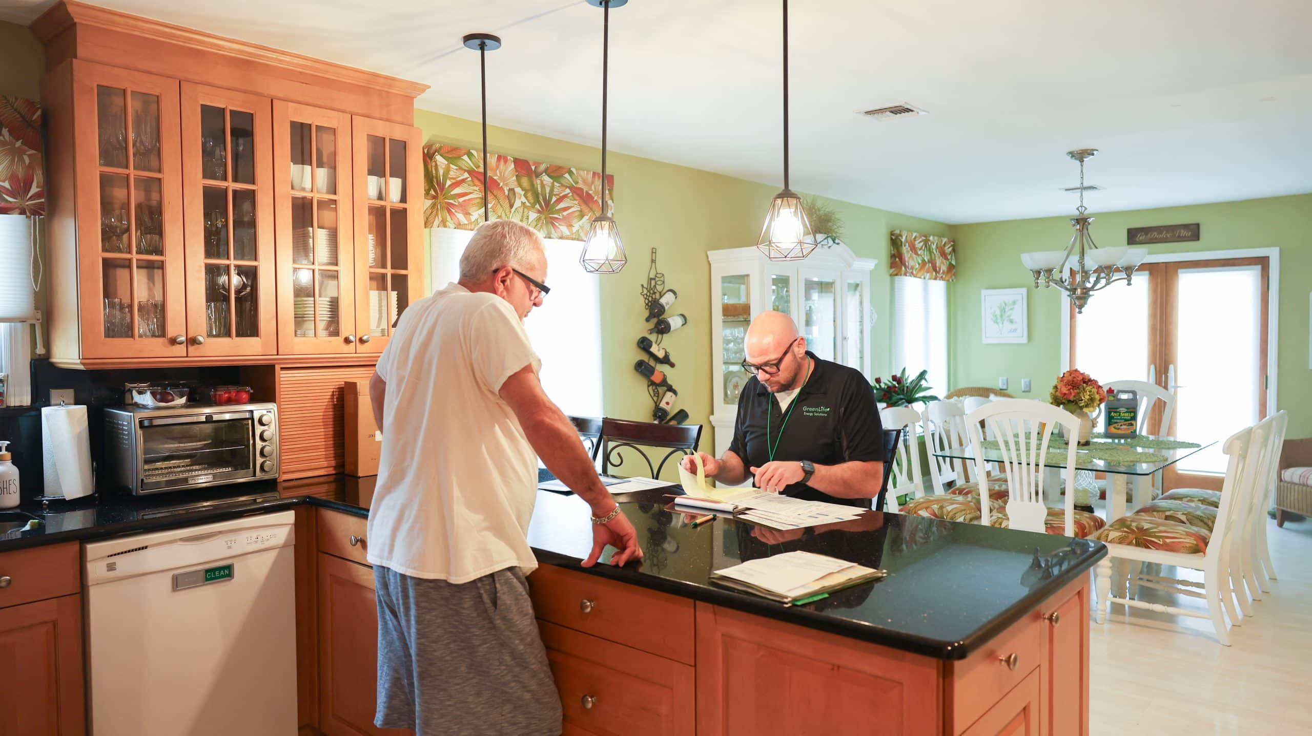 First step of an energy assessment. Energy auditor explaining the steps to the home owner.