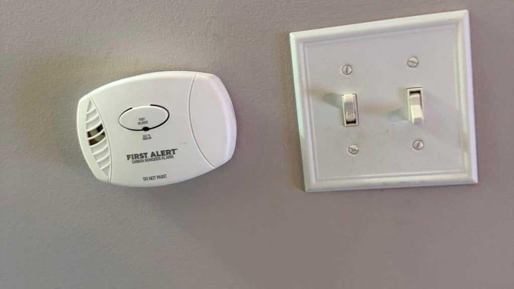 Carbon monoxide alarm mounted on a wall in a New Jersey home for carbon monoxide safety